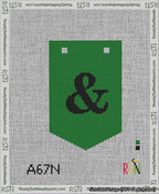A taped needlepoint canvas with the design: Banner 13 mesh count Pointed Ampersand Black on Green.