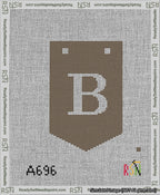 A taped needlepoint canvas with the design: Banner 13 mesh count Pointed B White on Brown.