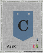 A taped needlepoint canvas with the design: Banner 13 mesh count Pointed C Black on Blue.