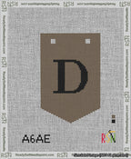 A taped needlepoint canvas with the design: Banner 13 mesh count Pointed D Black on Brown.