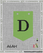A taped needlepoint canvas with the design: Banner 13 mesh count Pointed D Black on Light Green.