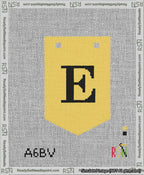 A taped needlepoint canvas with the design: Banner 13 mesh count Pointed E Black on Yellow.