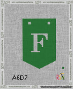 A taped needlepoint canvas with the design: Banner 13 mesh count Pointed F White on Green.