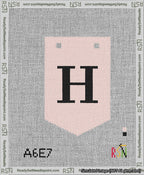 A taped needlepoint canvas with the design: Banner 13 mesh count Pointed H Black on Pink.