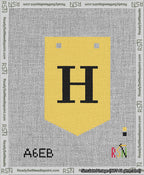 A taped needlepoint canvas with the design: Banner 13 mesh count Pointed H Black on Yellow.