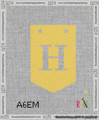 A taped needlepoint canvas with the design: Banner 13 mesh count Pointed H White on Yellow.