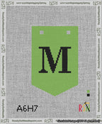 A taped needlepoint canvas with the design: Banner 13 mesh count Pointed M Black on Light Green.
