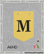 A taped needlepoint canvas with the design: Banner 13 mesh count Pointed M Black on Yellow.