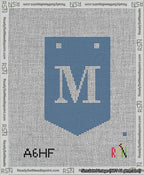 A taped needlepoint canvas with the design: Banner 13 mesh count Pointed M White on Blue.