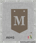 A taped needlepoint canvas with the design: Banner 13 mesh count Pointed M White on Brown.
