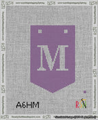 A taped needlepoint canvas with the design: Banner 13 mesh count Pointed M White on Purple.