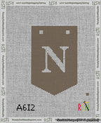 A taped needlepoint canvas with the design: Banner 13 mesh count Pointed N White on Brown.