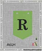 A taped needlepoint canvas with the design: Banner 13 mesh count Pointed R Black on Light Green.
