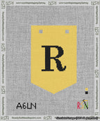 A taped needlepoint canvas with the design: Banner 13 mesh count Pointed R Black on Yellow.