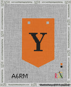A taped needlepoint canvas with the design: Banner 13 mesh count Pointed Y Black on Orange.