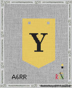 A taped needlepoint canvas with the design: Banner 13 mesh count Pointed Y Black on Yellow.