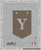 A taped needlepoint canvas with the design: Banner 13 mesh count Pointed Y White on Brown.