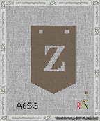 A taped needlepoint canvas with the design: Banner 13 mesh count Pointed Z White on Brown.