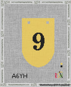 A taped needlepoint canvas with the design: Banner 13 mesh count Rounded 9 Black on Yellow.