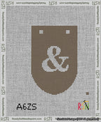 A taped needlepoint canvas with the design: Banner 13 mesh count Rounded Ampersand White on Brown.
