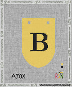 A taped needlepoint canvas with the design: Banner 13 mesh count Rounded B Black on Yellow.
