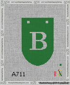 A taped needlepoint canvas with the design: Banner 13 mesh count Rounded B White on Green.
