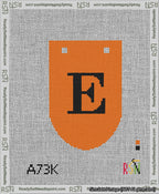 A taped needlepoint canvas with the design: Banner 13 mesh count Rounded E Black on Orange.