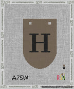 A taped needlepoint canvas with the design: Banner 13 mesh count Rounded H Black on Brown.