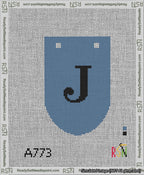 A taped needlepoint canvas with the design: Banner 13 mesh count Rounded J Black on Blue.