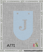 A taped needlepoint canvas with the design: Banner 13 mesh count Rounded J White on Light Blue.