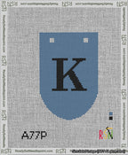 A taped needlepoint canvas with the design: Banner 13 mesh count Rounded K Black on Blue.