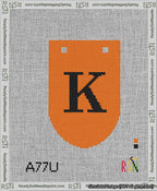 A taped needlepoint canvas with the design: Banner 13 mesh count Rounded K Black on Orange.
