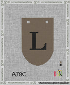A taped needlepoint canvas with the design: Banner 13 mesh count Rounded L Black on Brown.