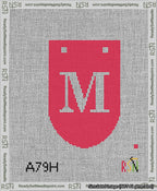 A taped needlepoint canvas with the design: Banner 13 mesh count Rounded M White on Red.