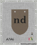 A taped needlepoint canvas with the design: Banner 13 mesh count Rounded nd Black on Brown.