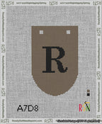 A taped needlepoint canvas with the design: Banner 13 mesh count Rounded R Black on Brown.