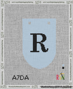 A taped needlepoint canvas with the design: Banner 13 mesh count Rounded R Black on Light Blue.