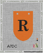A taped needlepoint canvas with the design: Banner 13 mesh count Rounded R Black on Orange.