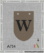 A taped needlepoint canvas with the design: Banner 13 mesh count Rounded W Black on Brown.
