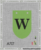 A taped needlepoint canvas with the design: Banner 13 mesh count Rounded W Black on Light Green.