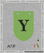 A taped needlepoint canvas with the design: Banner 13 mesh count Rounded Y Black on Light Green.