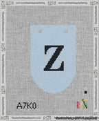 A taped needlepoint canvas with the design: Banner 13 mesh count Rounded Z Black on Light Blue.