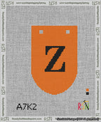 A taped needlepoint canvas with the design: Banner 13 mesh count Rounded Z Black on Orange.