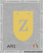 A taped needlepoint canvas with the design: Banner 13 mesh count Rounded Z White on Yellow.