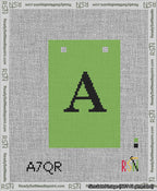 A taped needlepoint canvas with the design: Banner 13 mesh count Squared A Black on Light Green.