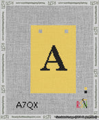 A taped needlepoint canvas with the design: Banner 13 mesh count Squared A Black on Yellow.