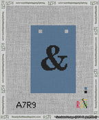 A taped needlepoint canvas with the design: Banner 13 mesh count Squared Ampersand Black on Blue.