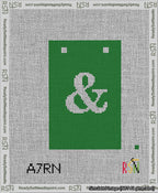 A taped needlepoint canvas with the design: Banner 13 mesh count Squared Ampersand White on Green.