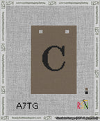 A taped needlepoint canvas with the design: Banner 13 mesh count Squared C Black on Brown.