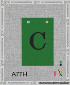 A taped needlepoint canvas with the design: Banner 13 mesh count Squared C Black on Green.